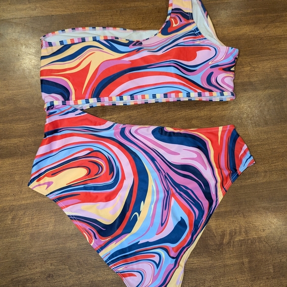 Vibrant Red and Blue One Piece with Artistic Swirls - Picture 5 of 7